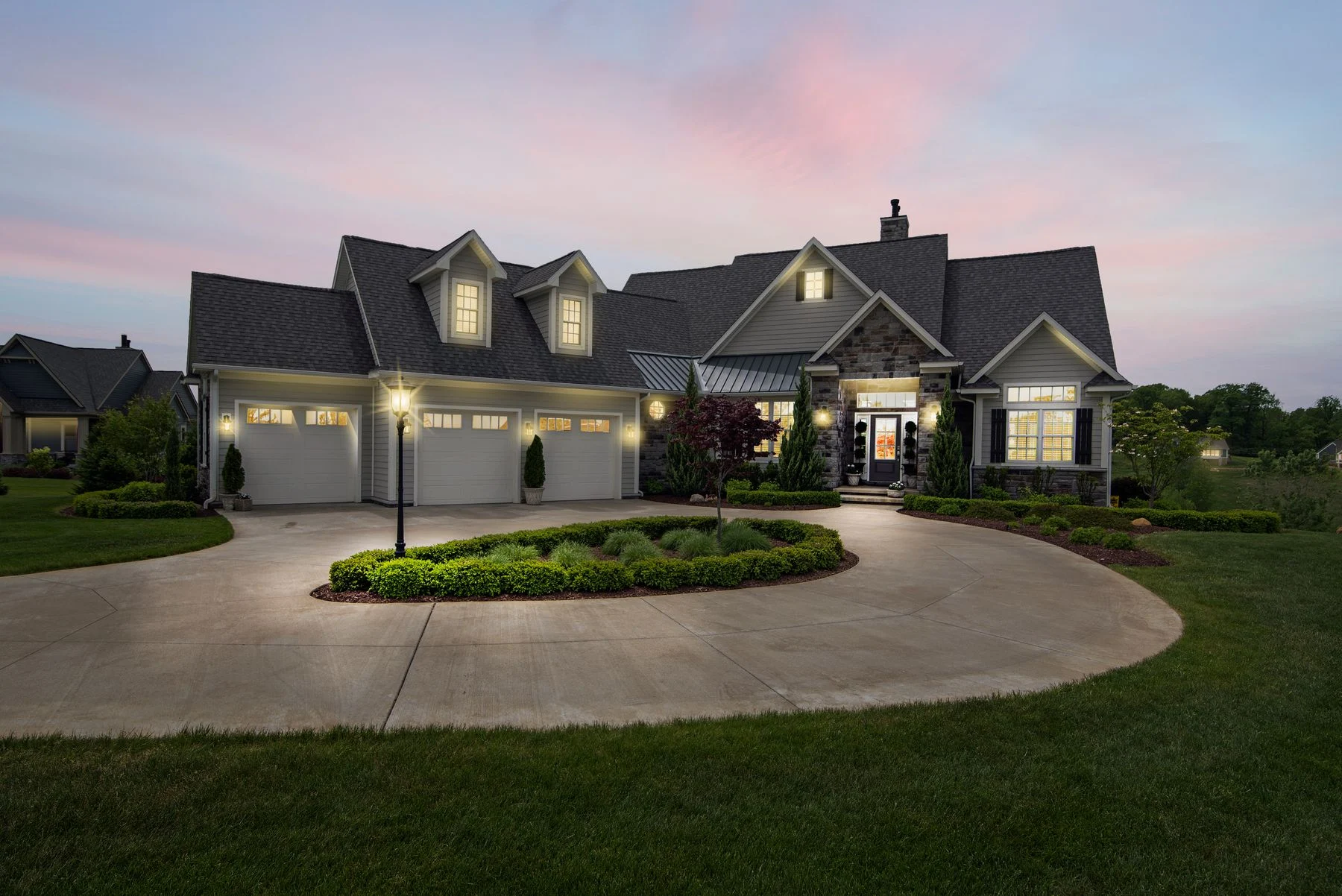 An illuminated home at dusk